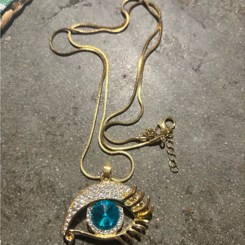 Gold Eye Pendant Necklace with Blue Gemstone